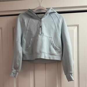 Lululemon Women's Light Blue cropped scuba hoodie.